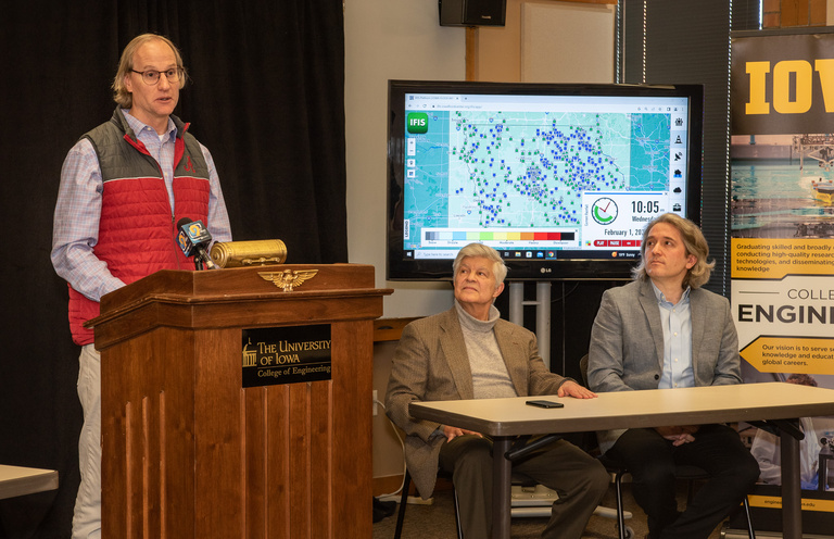 Steve Burian from CIROH stands at the podium in the IIHR meeting room, addressing the crowd